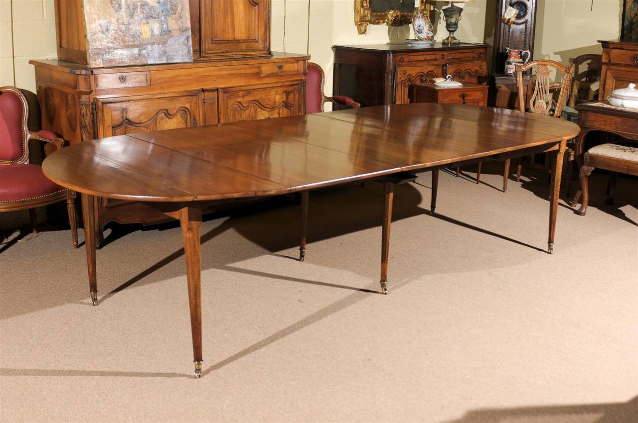 French walnut extending dining table with tapering legs, three leaves and brass castors, circa 1800.

To view our entire inventory, please visit our personal website.

William word fine antiques: Atlanta's source for antique interiors since 1956.