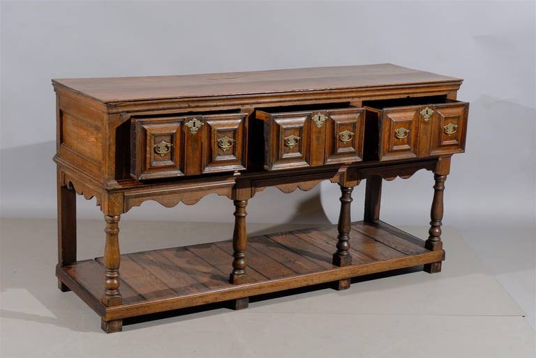 Jacobean 19th Century English Oak Dresser Base with Lower Shelf and Three Drawers