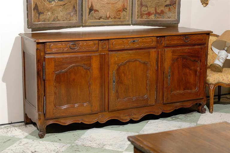 A Louis XV French walnut enfilade with three drawers, three cabinets below with interior shelving, carved shaped apron and all resting on cabriole feet.

William word fine antiques: Atlanta's source for antique interiors since 1956.