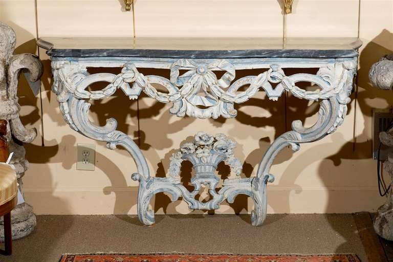 A Louis XVI painted console table in blue grey hues with grey serpentine marble top, pierced apron and cabriole legs with stretcher below. 

To see all of our inventory, please visit our website at: www.williamwordantiques.com

William Word Fine