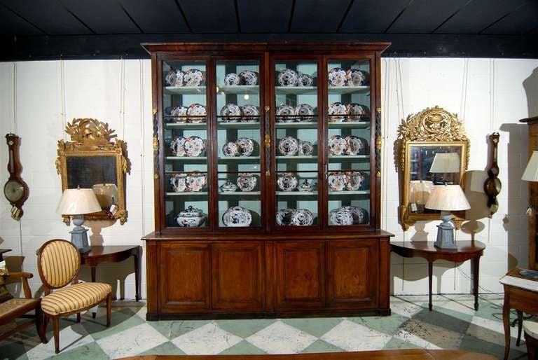 A 19th century large continental bookcase with glazed upper doors with interior shelving and 4 paneled doors below. 

To see all our inventory, please visit our website at: www.williamwordantiques.com

William Word Fine Antiques: Atlanta's