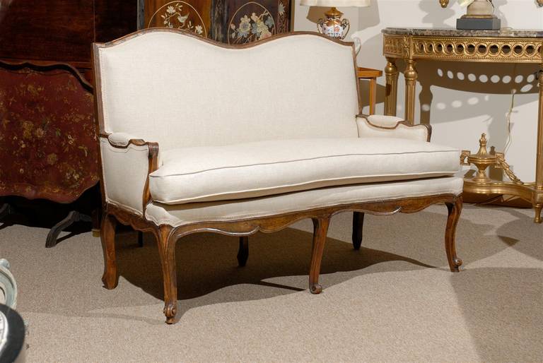 A petite French Louis XV walnut settee/loveseat. 

William Word Fine Antiques: Atlanta'a source for antique interiors since 1956.