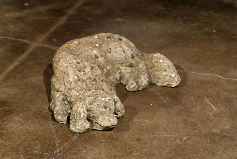 20th Century French Reclining Cast Stone Dog with Weathered Appearance from the 1930s