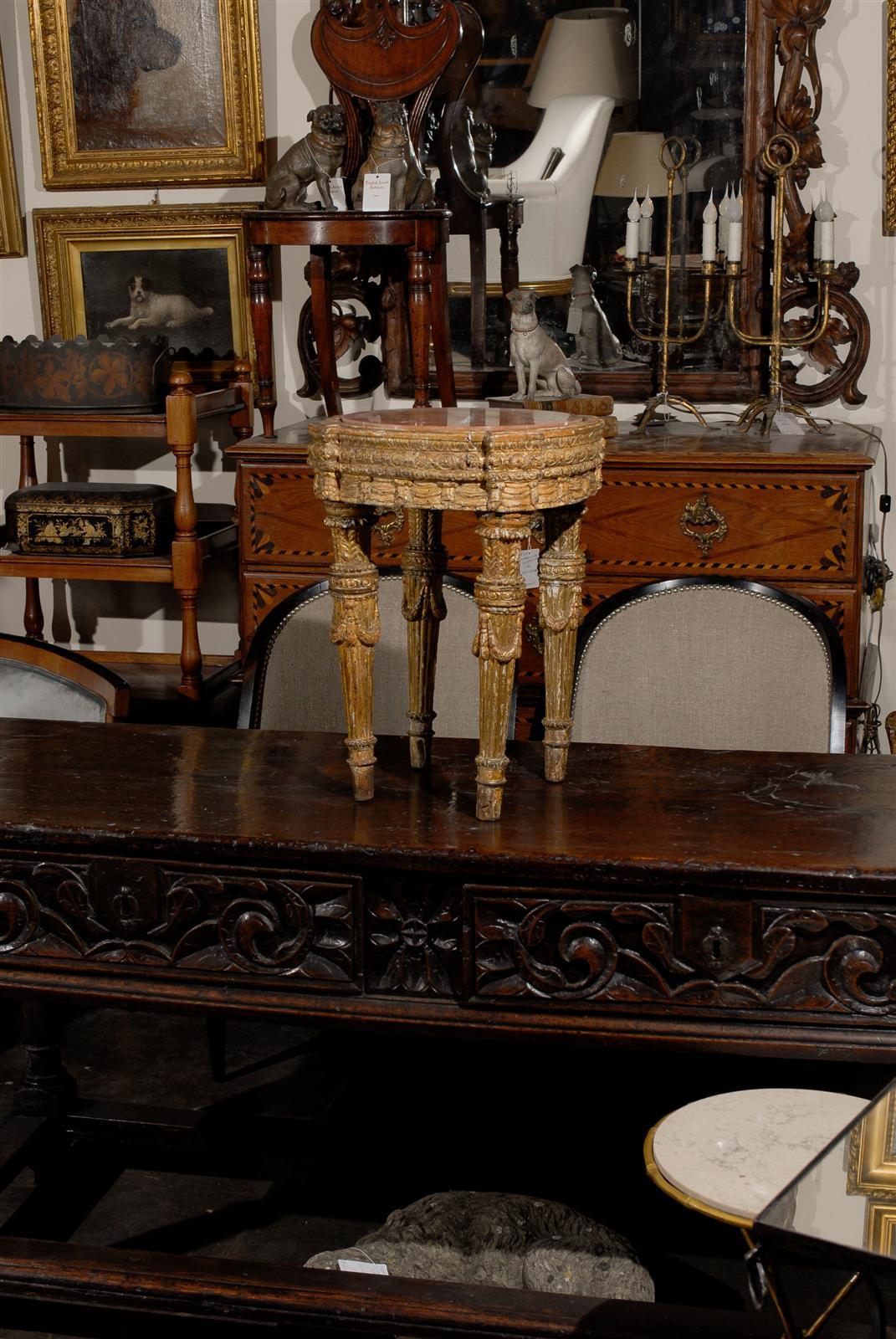 18 th c. Italian giltwood table with a marble top.