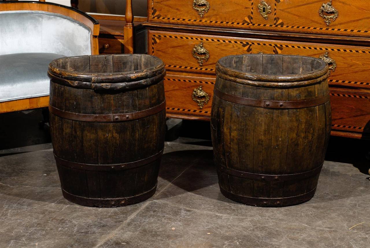 Two French barrels used for the collection of champagne grapes in the 1880s. These barrels were used (as similar barrels are used today) to collect champagne grapes in the vineyards of France. They are sold separately and are priced for each piece.