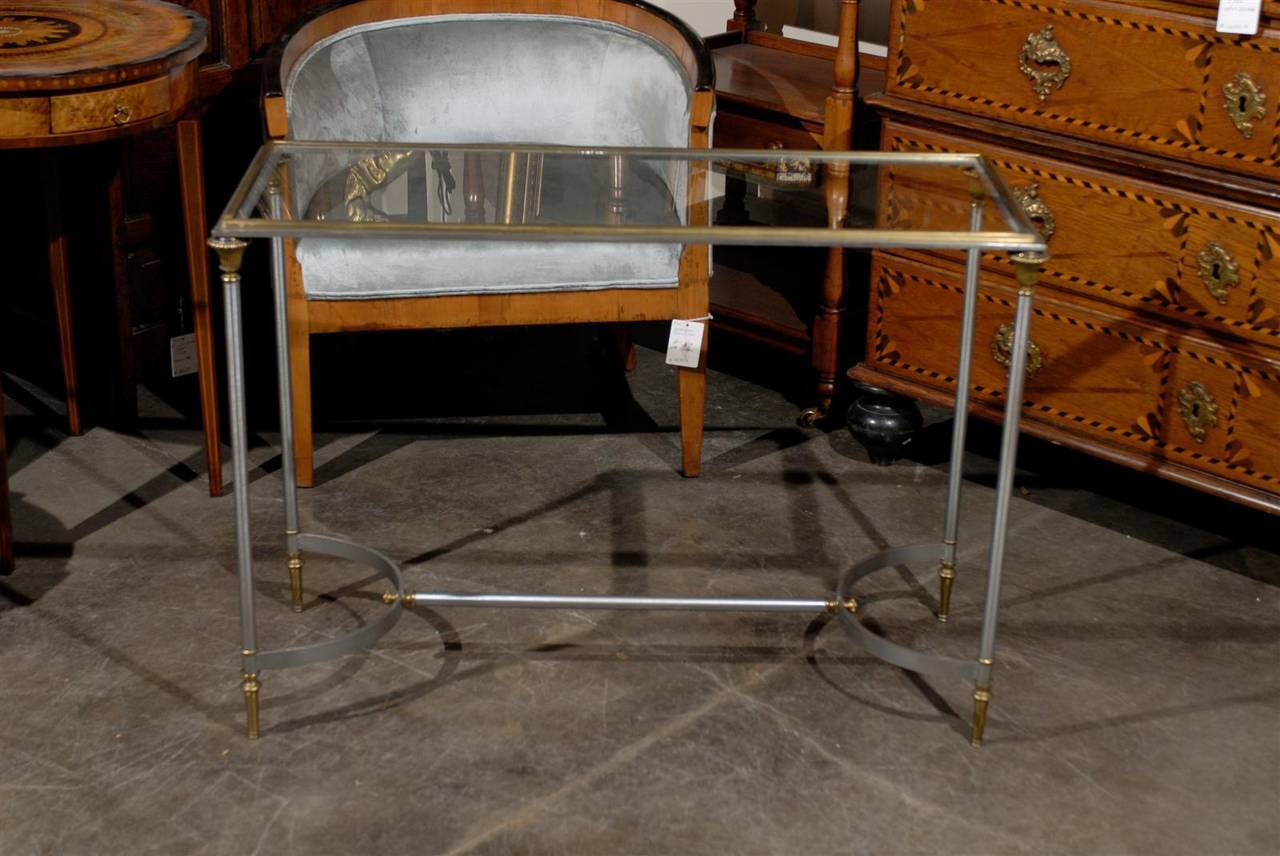 Steel and Brass console table with glass top.