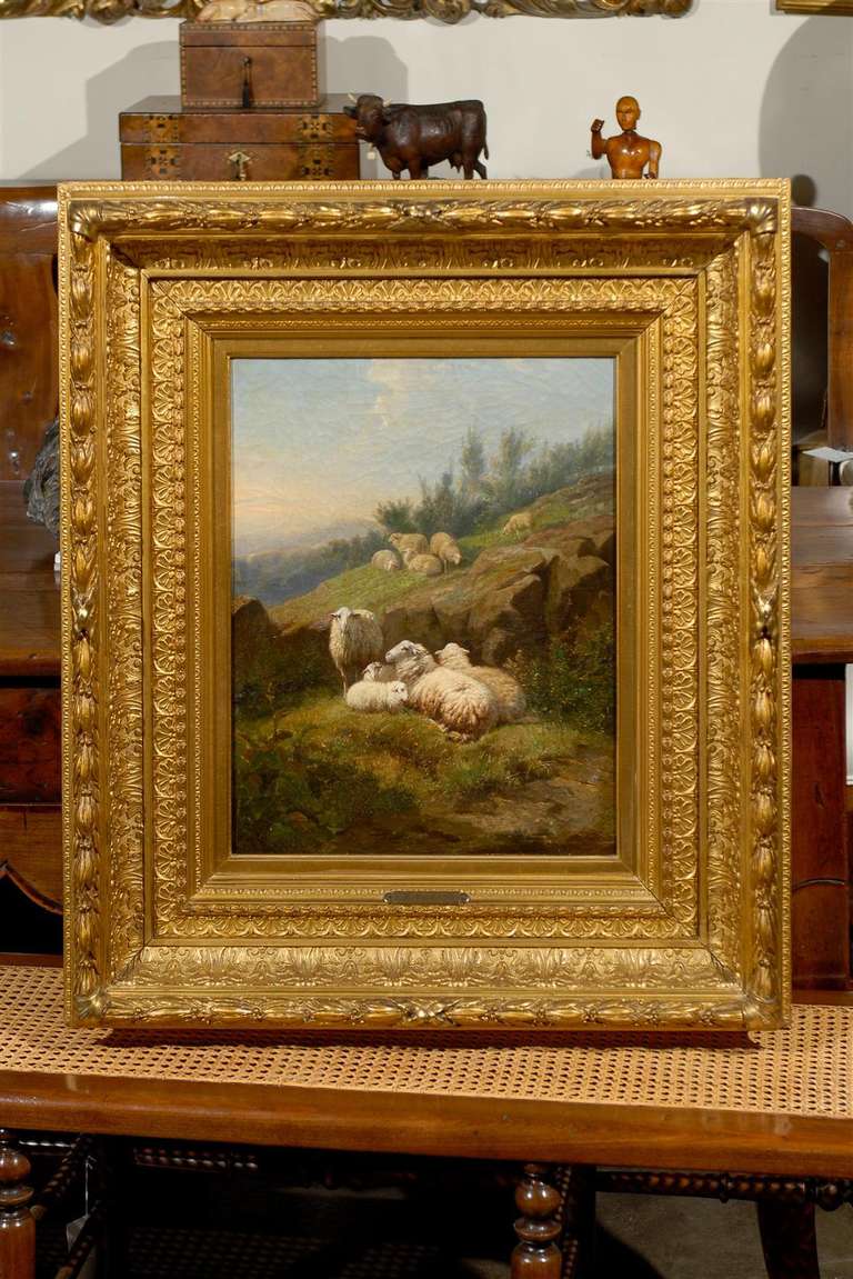 This exquisite Dutch vertical format oil on canvas painting from the mid-19th century depicts sheep in fields and is attributed to Karel van Contich. This is a beautifully serene scene: a flock of sheep, divided into several groups, is resting on