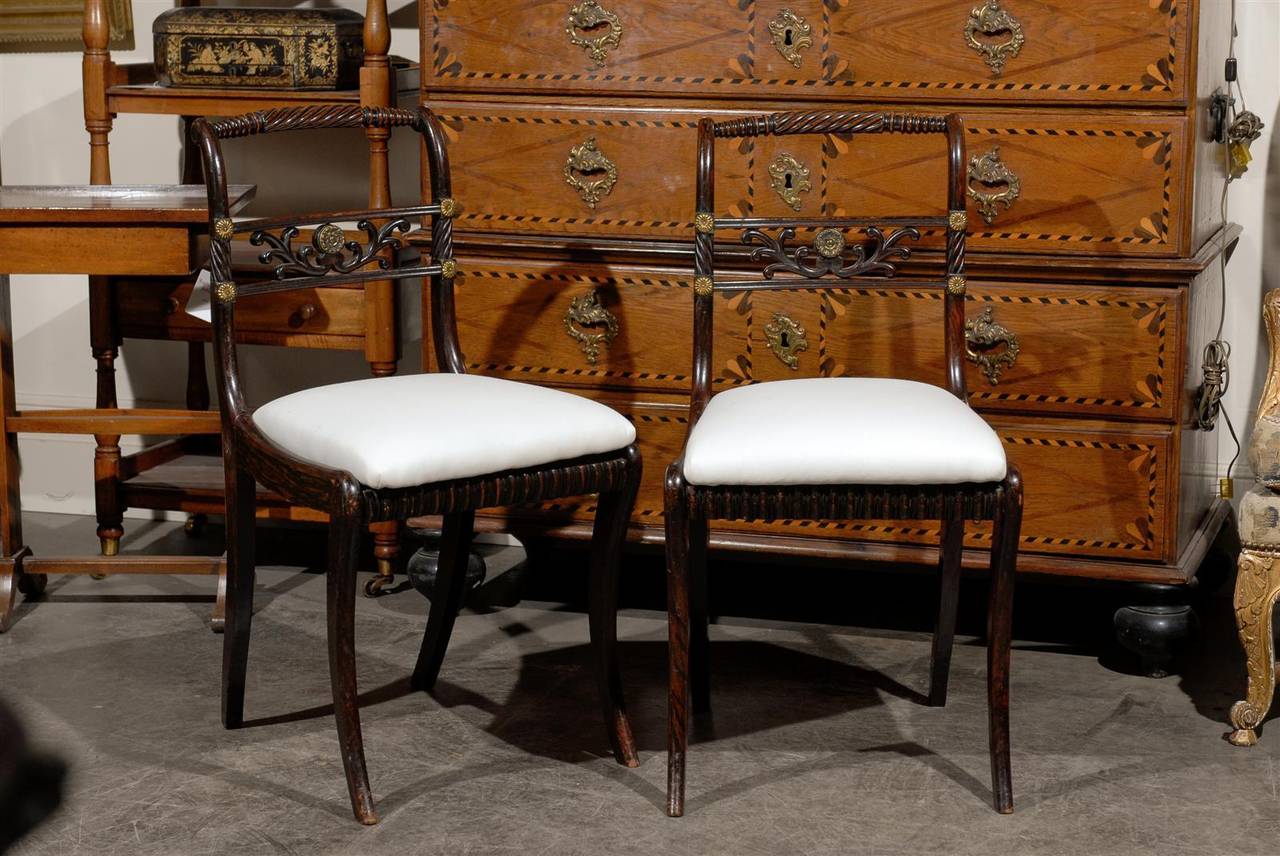 Pair of English Regency side chairs with grain paint, rosewood and brass.