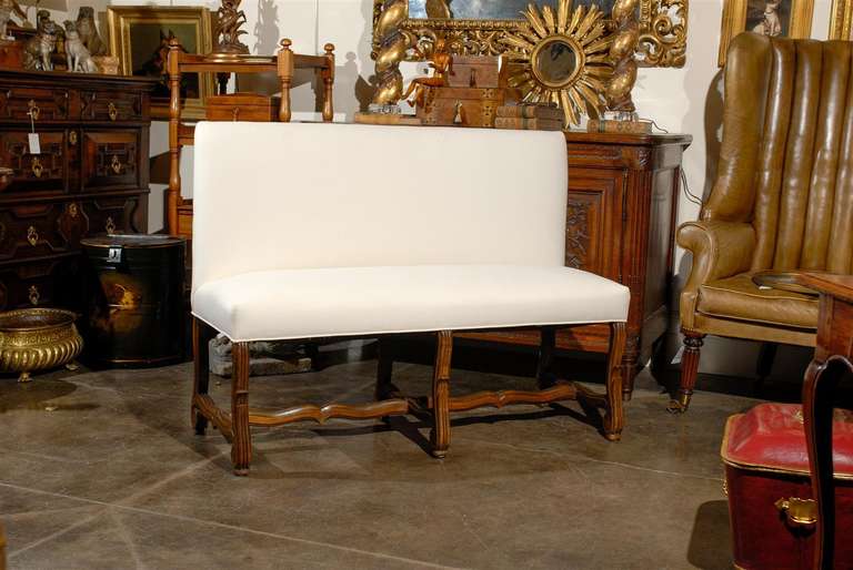 French upholstered bench/settee with back and curved legs.