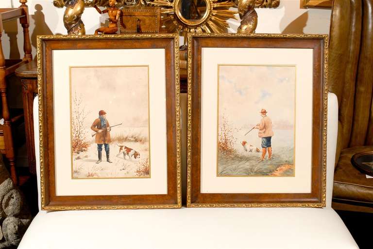 A pair of French watercolor paintings showcasing hunters and dogs from the turn of the 19th-20th century. Each painting displays a landscape featuring a man dressed for the hunt with his gun, accompanied by his dog. Following the French taste for