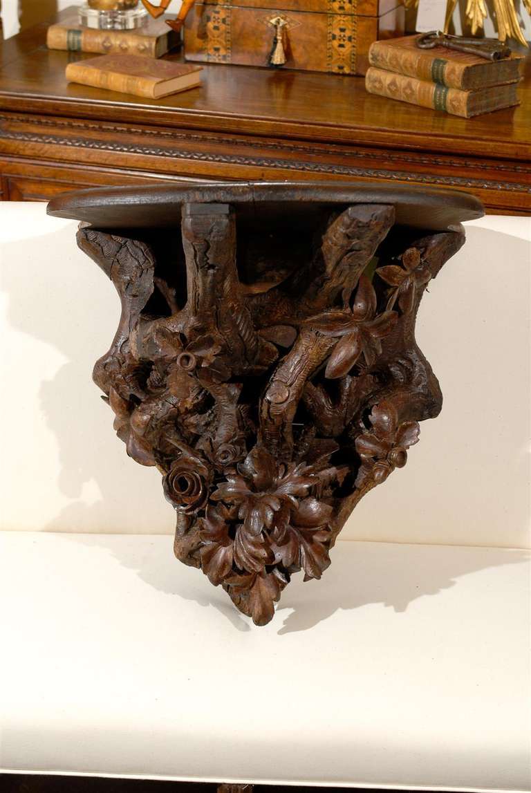 Black forest carved console / bracket / shelf with acorns, flowers and leaves.