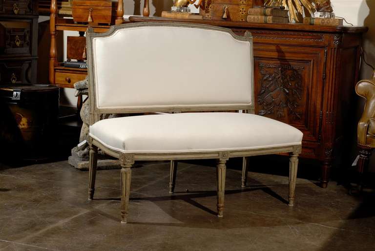 Painted French settee / bench with back upholstered in new muslin.