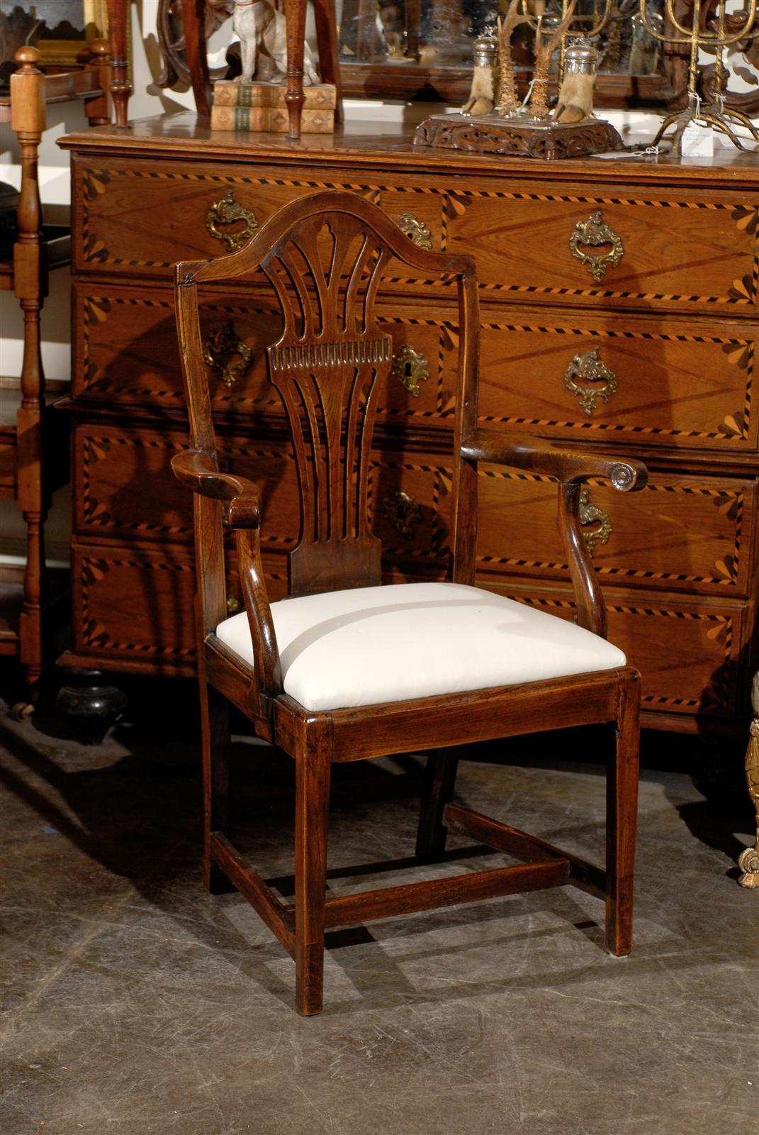 English oak armchair with upholstered seat.
