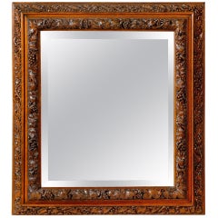 English 1880s Rectangular Mirror with Bevelled Glass and Foliage Adorned Frame