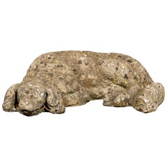 French Reclining Cast Stone Dog with Weathered Appearance from the 1930s