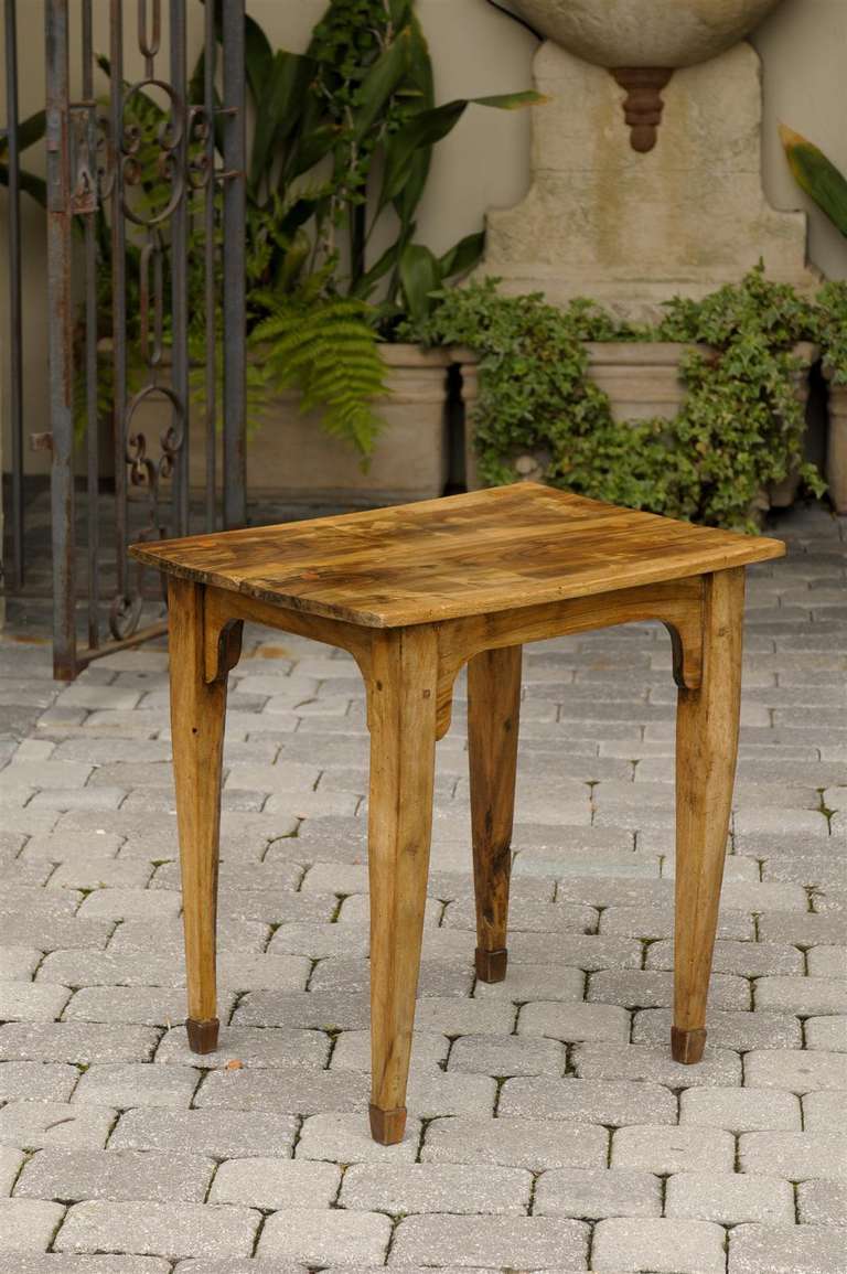 A simple and skillfully crafted French 19th century table made of olive wood. This petite French side table from circa 1870 is made of olive wood, which is ubiquitous in Provence and much of the southern part of the country. The tapered legs are