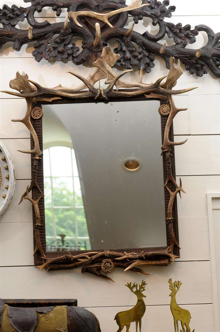 Mirror with frame of Antlers and some carved bone decorations.