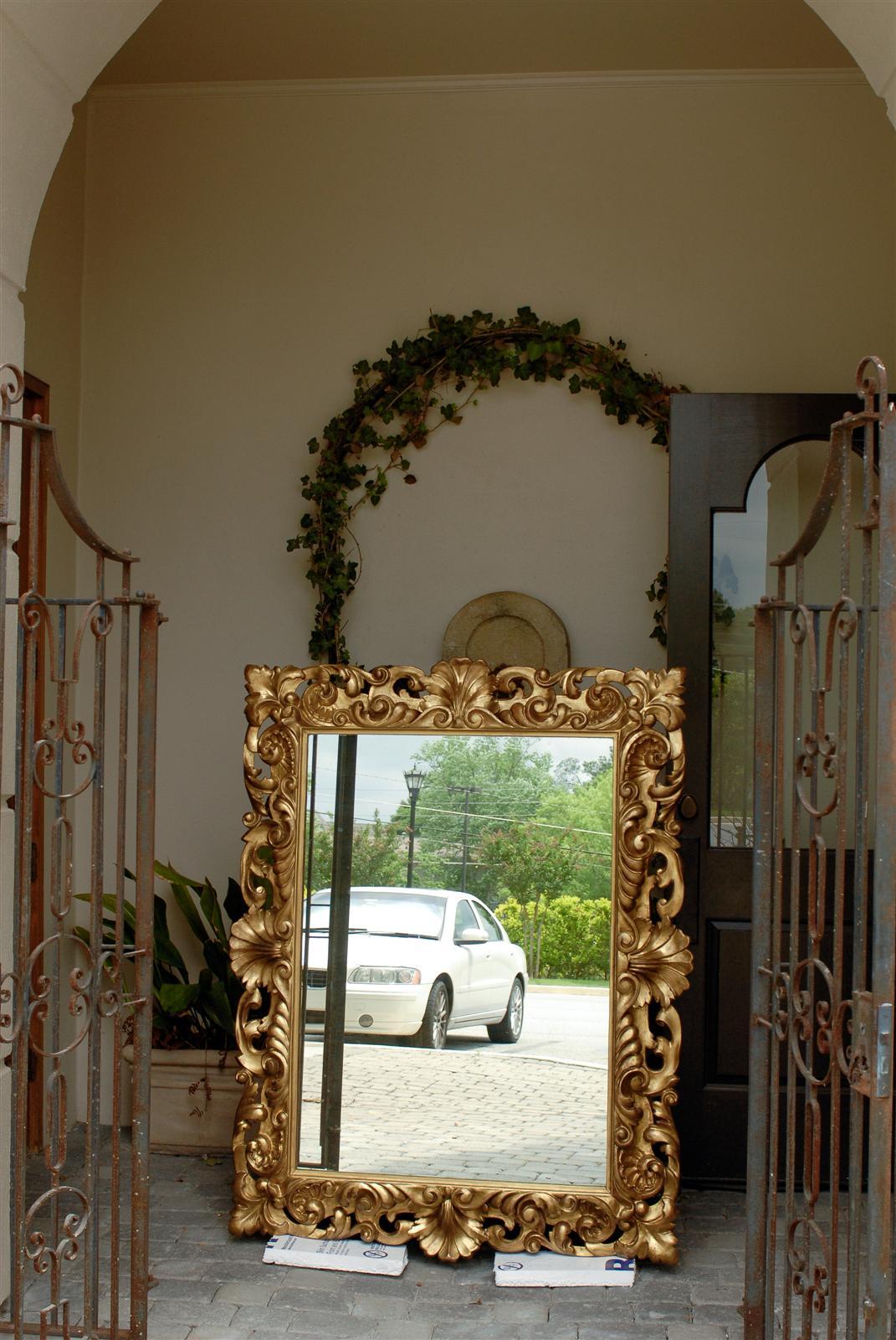 Rococo Italian Large Size Mirror with Carved Giltwood Frame from the Late 19th Century