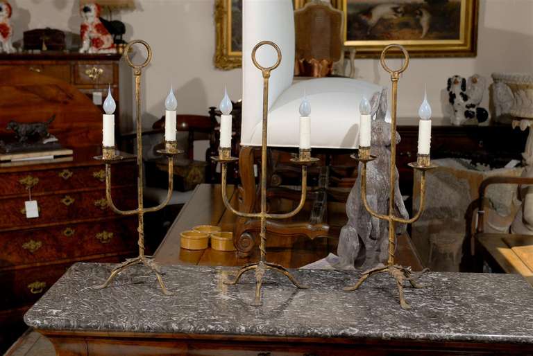 Three Gilt Iron Spanish Two-Arm Candelabra on Tripod Bases with Vegetal Décor