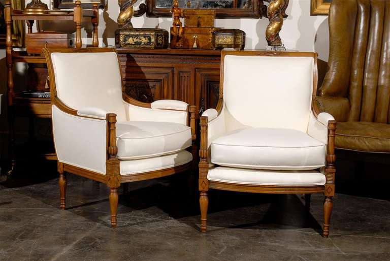 Pair of French Directoire style chairs with new muslin upholstery.