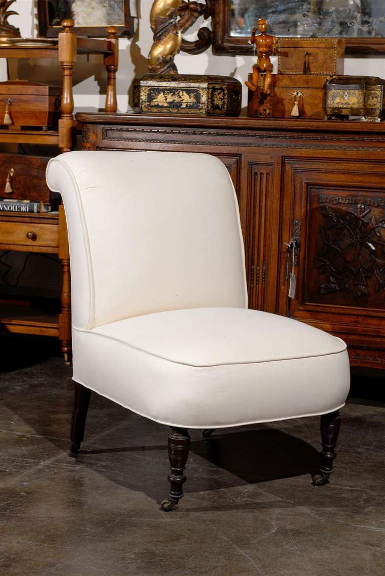 English slipper chair with castors.