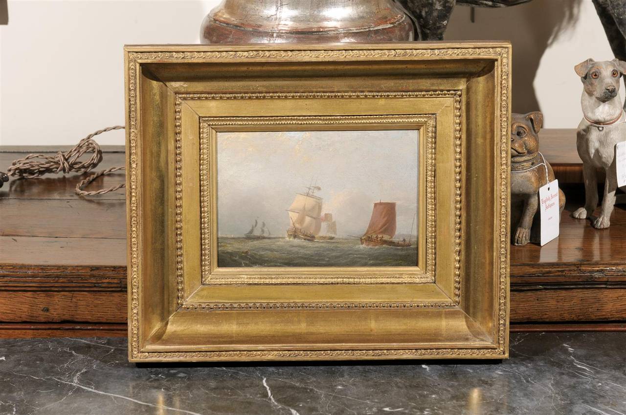 A small size English oil painting on board depicting ships at sea by John Swift. This English painting from the mid-19th century features, in very subdued tones, four ships at sea. Signed by John Swift, the scene depicts two ships with white masts