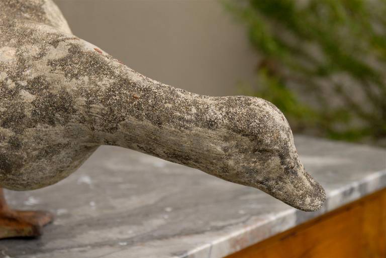 American Carved Stone Duck Sculpture with Iron Webbed Feet from the 1930s