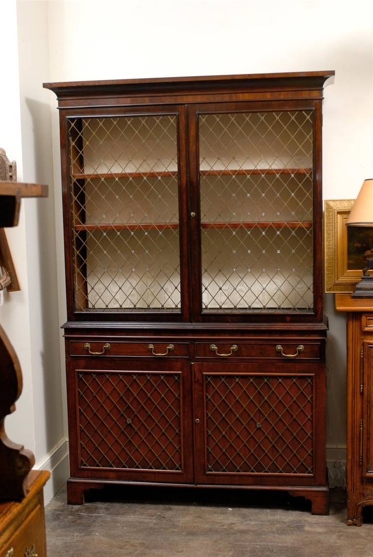 English Mahogany bookcase or cabinet with Grill doors. wired with lighting or lighting can be removed.