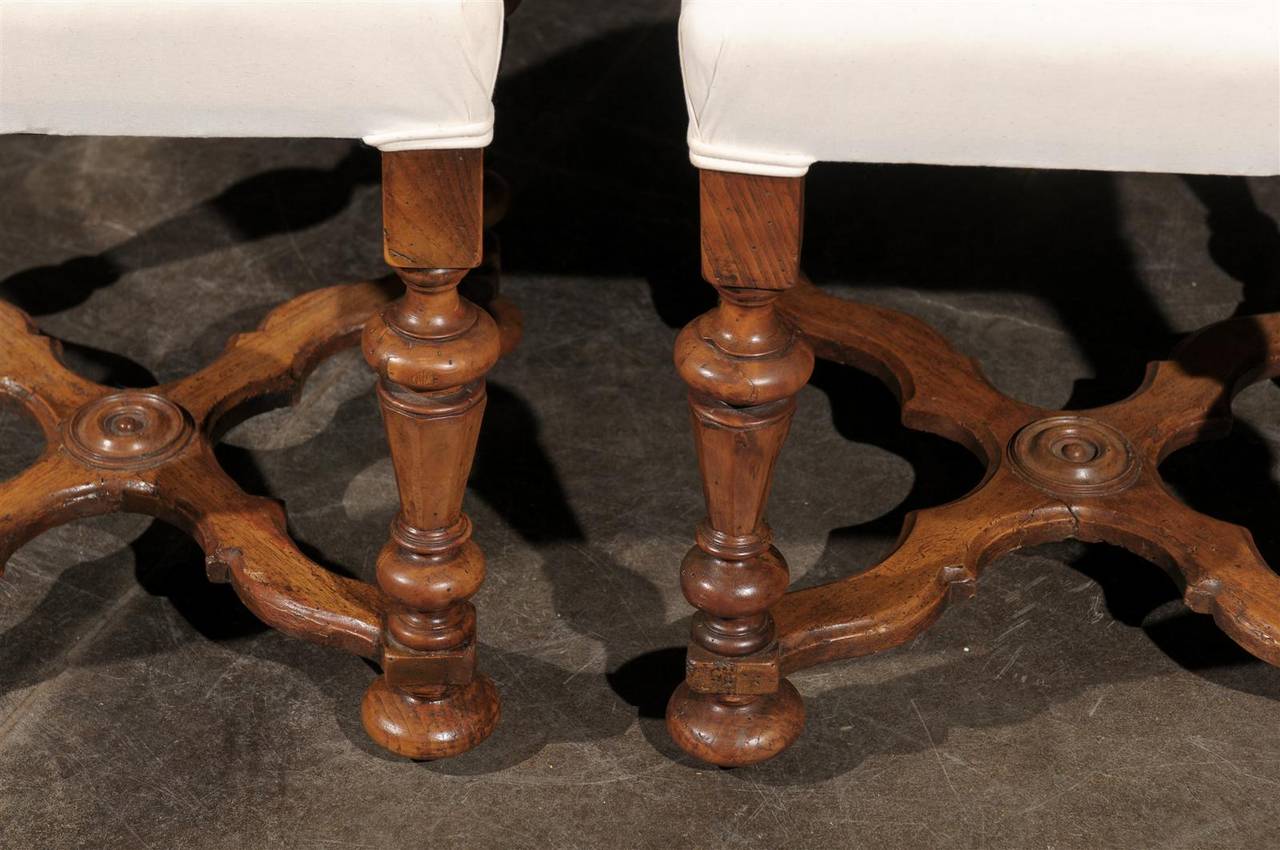 Upholstery Pair of English Upholstered Walnut Stools with Carved Stretcher