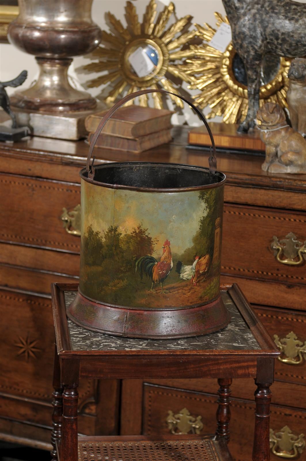 A French painted tole bucket with chicken barnyard scene from the late 19th century. Born in the later years of the 19th century during the French Third Republic, this tole bucket depicts a serene barnyard scene. A proud rooster (the French national