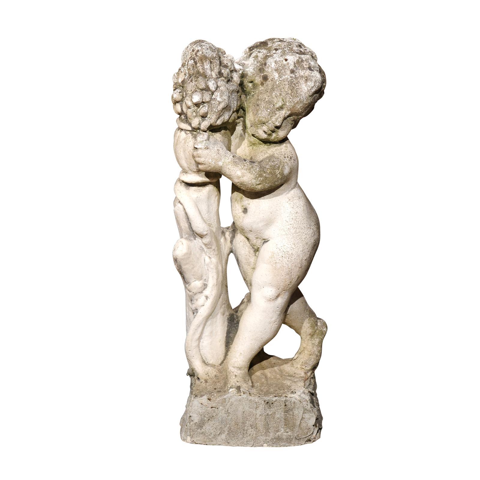 French Carved Stone Putti Sculpture with Grapes from the Mid 20th Century For Sale