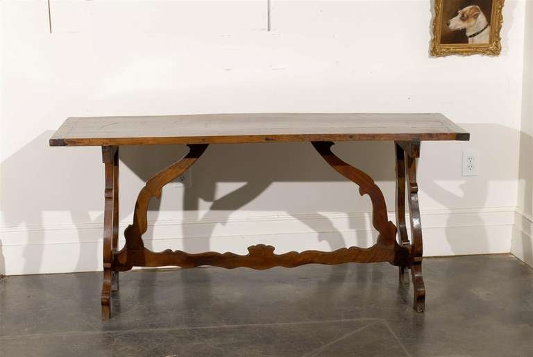 Carved Spanish Baroque Style Walnut Table with Stretcher from the Late 19th Century