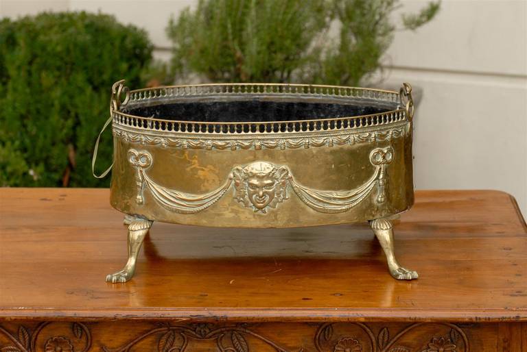 Pair of Dutch 1820s Jardinières with Repoussé Brass Décor and Paw Feet