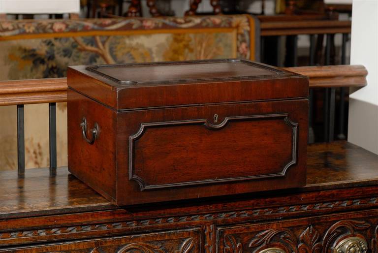 An early Georgian mahogany box from the late 18th century. This exquisite English box is made of a rich mahogany wood seemingly stained to perfection with the dark highlights around the raised trim highlighting the beauty of the base hue. The box