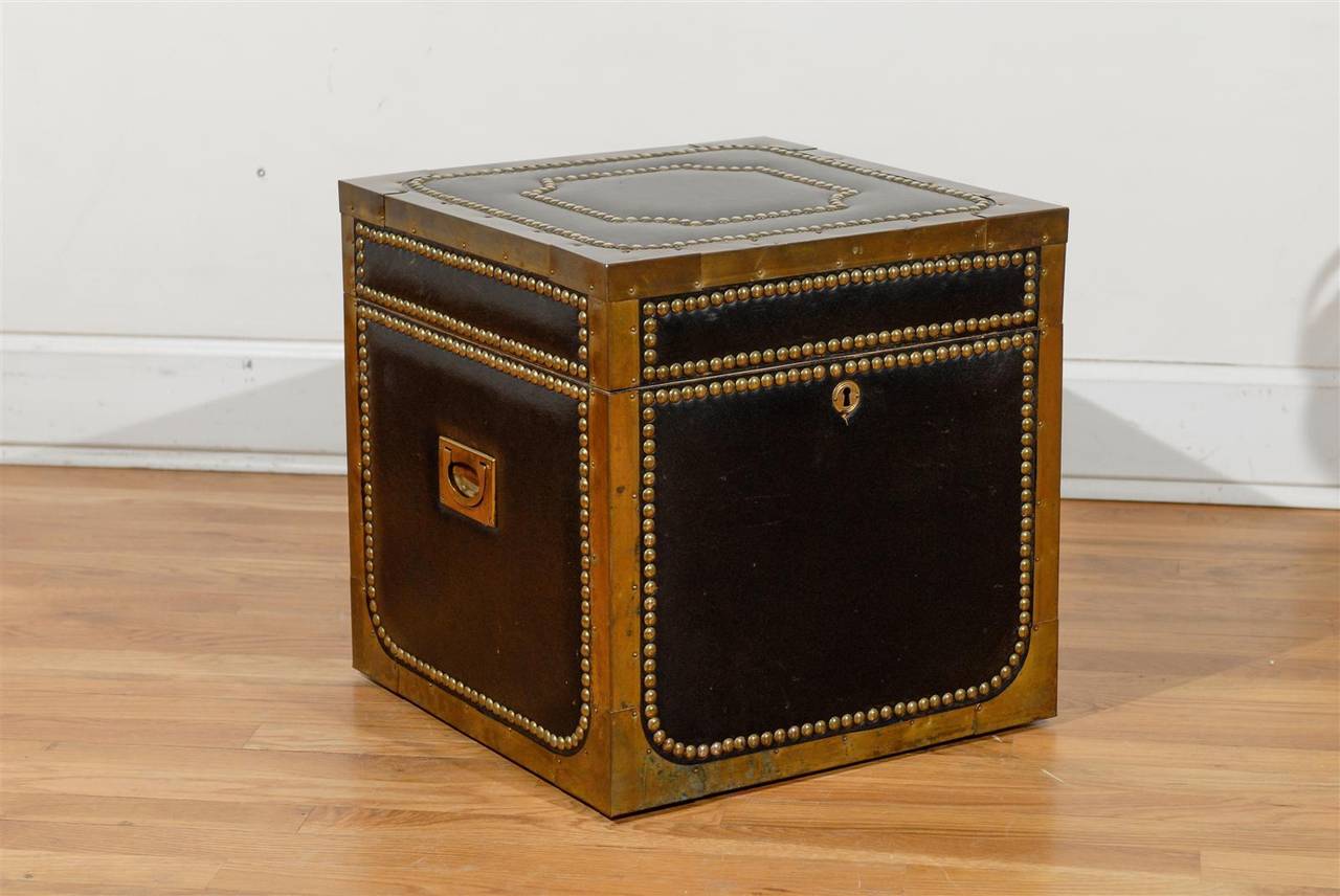 Black leather and brass trunk in Campaign style.