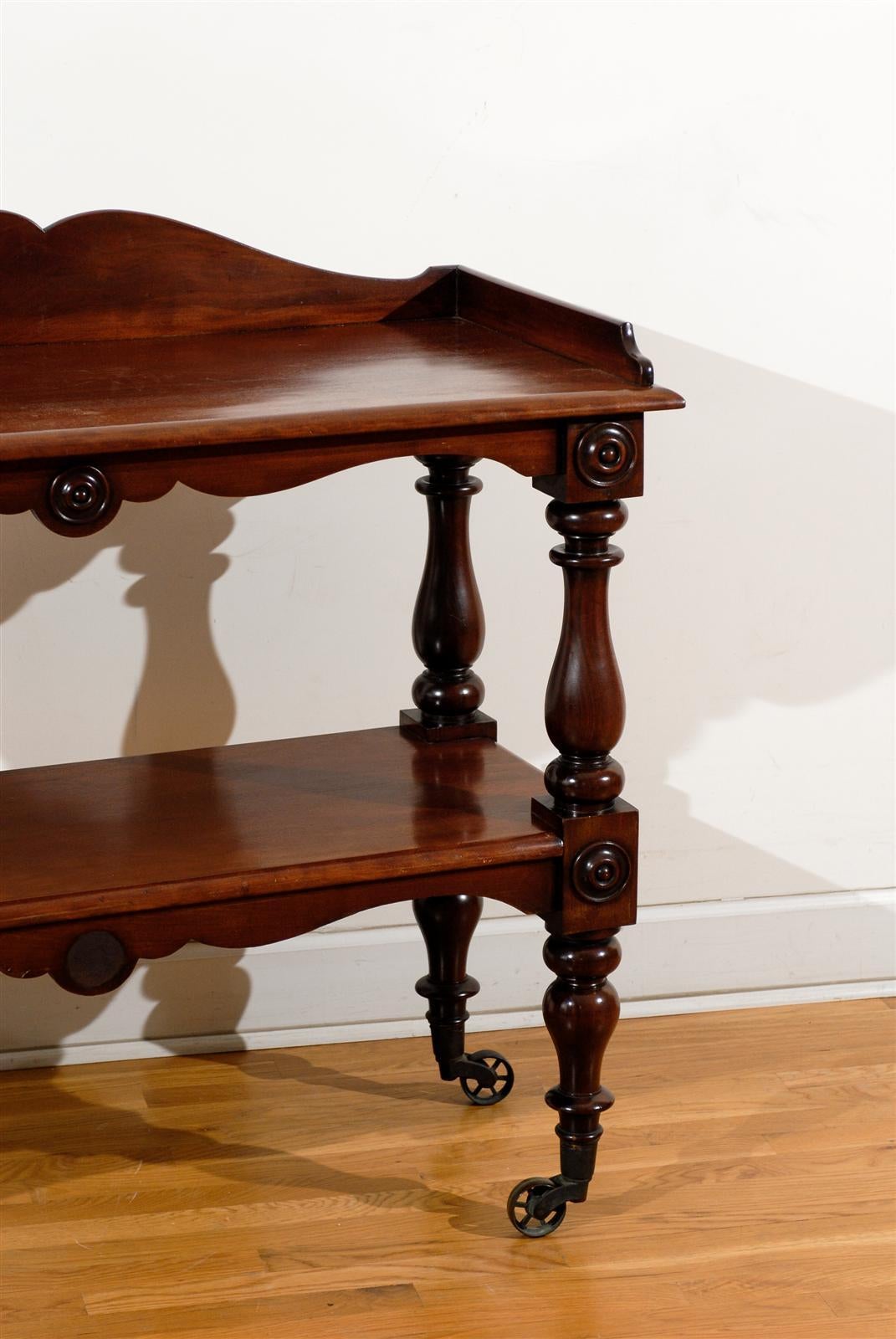 19th Century English 1840s Wooden Two-Tiered Trolley with Turned Legs and Large Casters