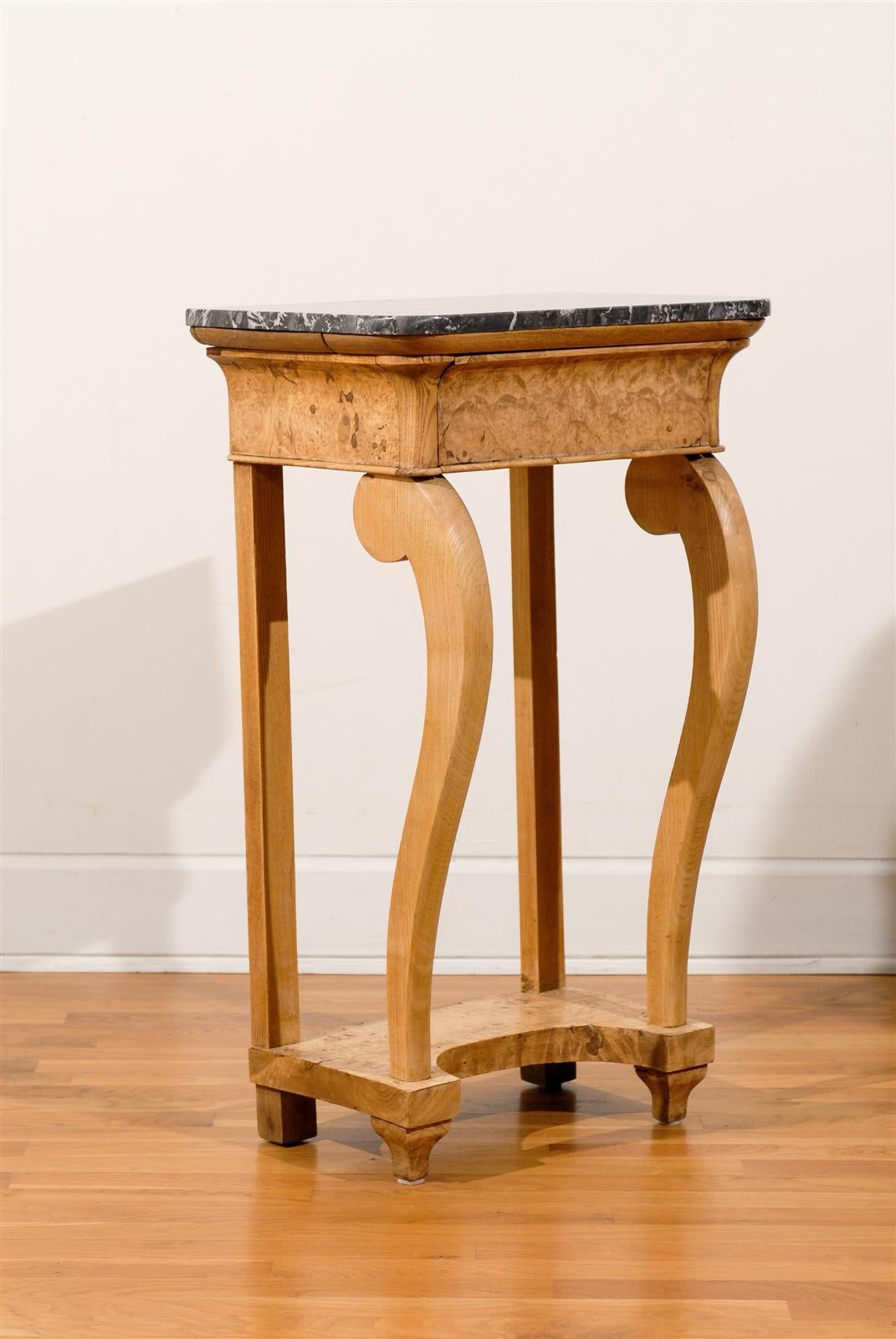 Pair of elm wood Empire console tables with marble tops.