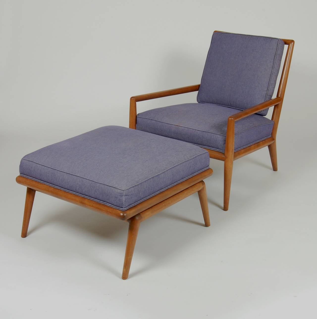 Lounge chair and ottoman by T. H. Robsjohn-Gibbings for Widdicomb, the frame and finish are in excellent vintage condition with a very light patina  and it has been reupholstered at some point . The ottomans dimensions are 16
