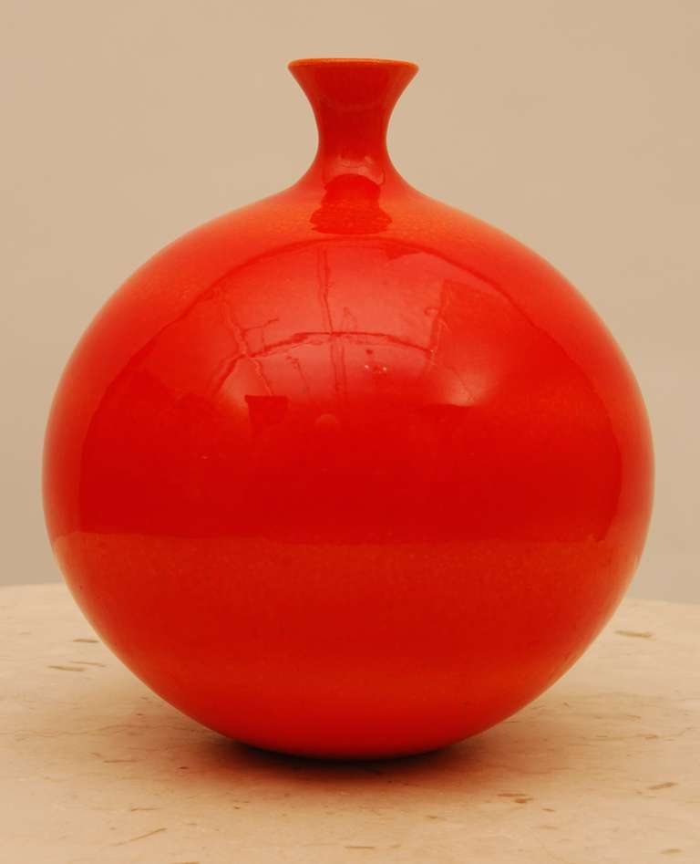 Red-Orange bottle vase circa 1961 by the hand of California ceramic artist James Lovera. His work is in the permanent collection of the Museum of Modern Art purchased in 1948. He was a professor of ceramics at San Jose State from 1948 to 1986, his