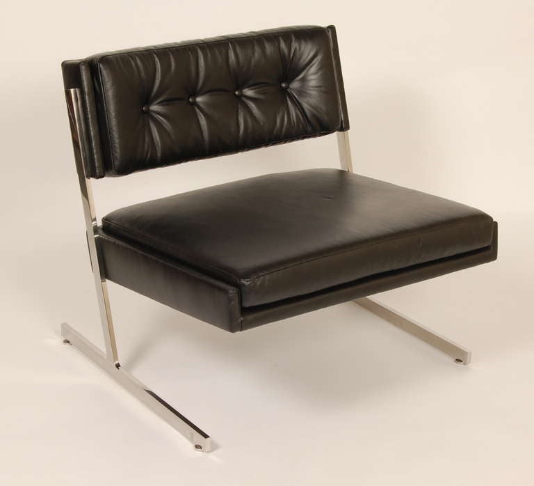 Harvey Probber lounge chair newly upholstered in leather, Tufted back connected via a T frame sled base crafted out of stainless steel. The circular glides are adjustable for uneven floors.