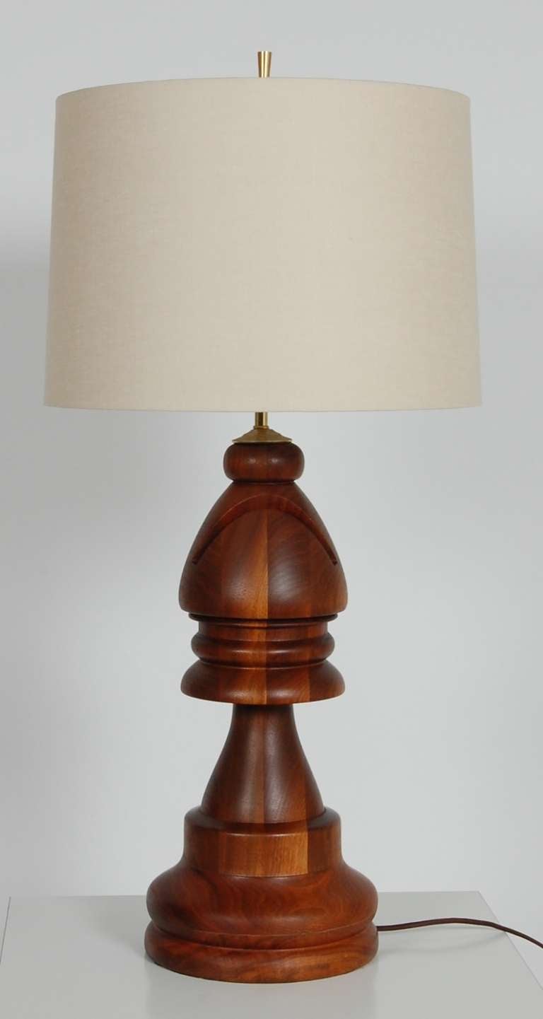 Lathe turned solid walnut table lamp in the form of a Bishop chess piece. Striking contrast from the mixed blocks of walnut used in its creation. Complete rewiring with high grade components. Shade not included.