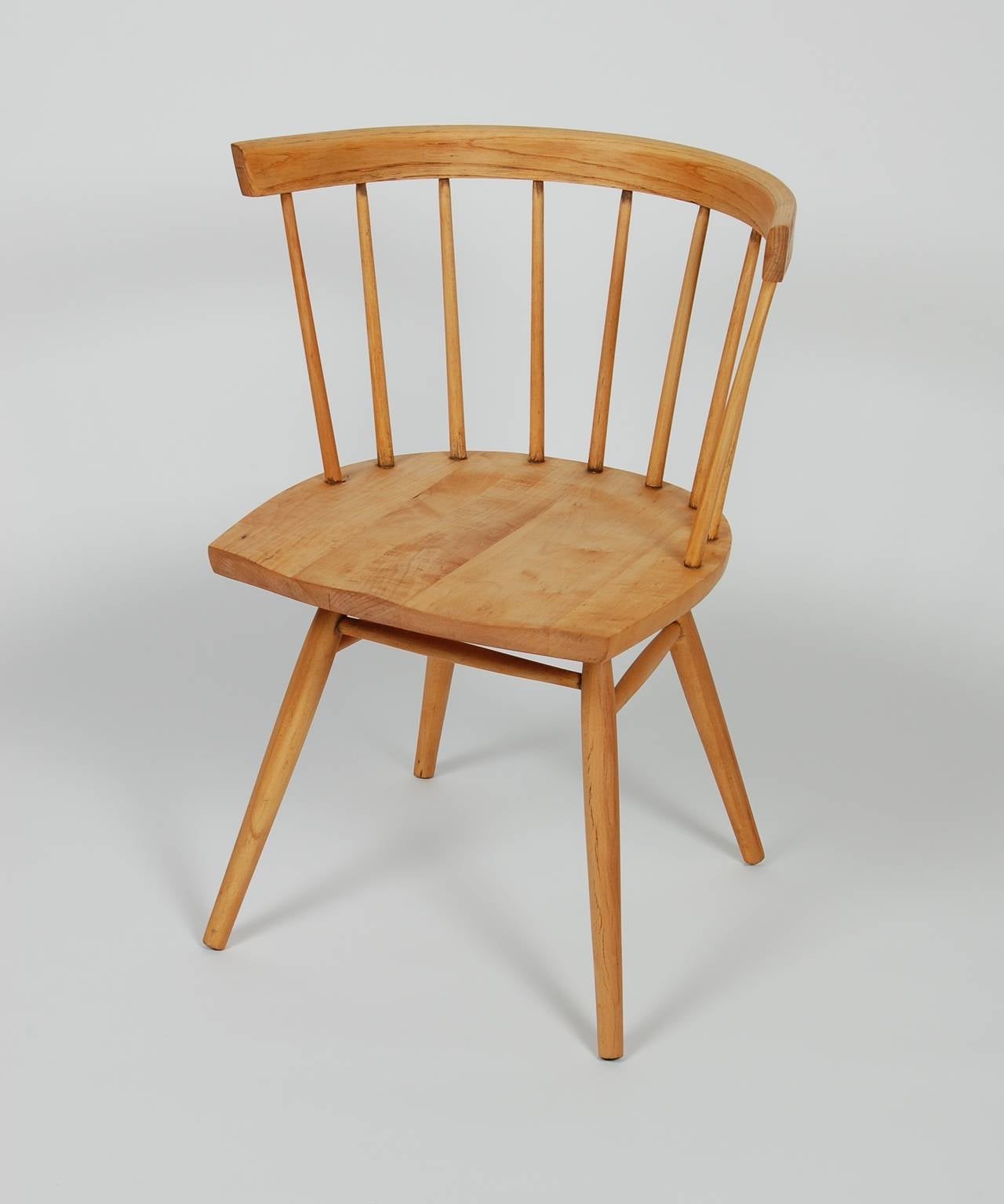 Original straight back chair (N19) designed by George Nakashima and produced by Knoll from 1946 to 1954. Made of maple an American hardwood, the style is a modernized version of the Classic Windsor chair. Having a curved back with spindles and