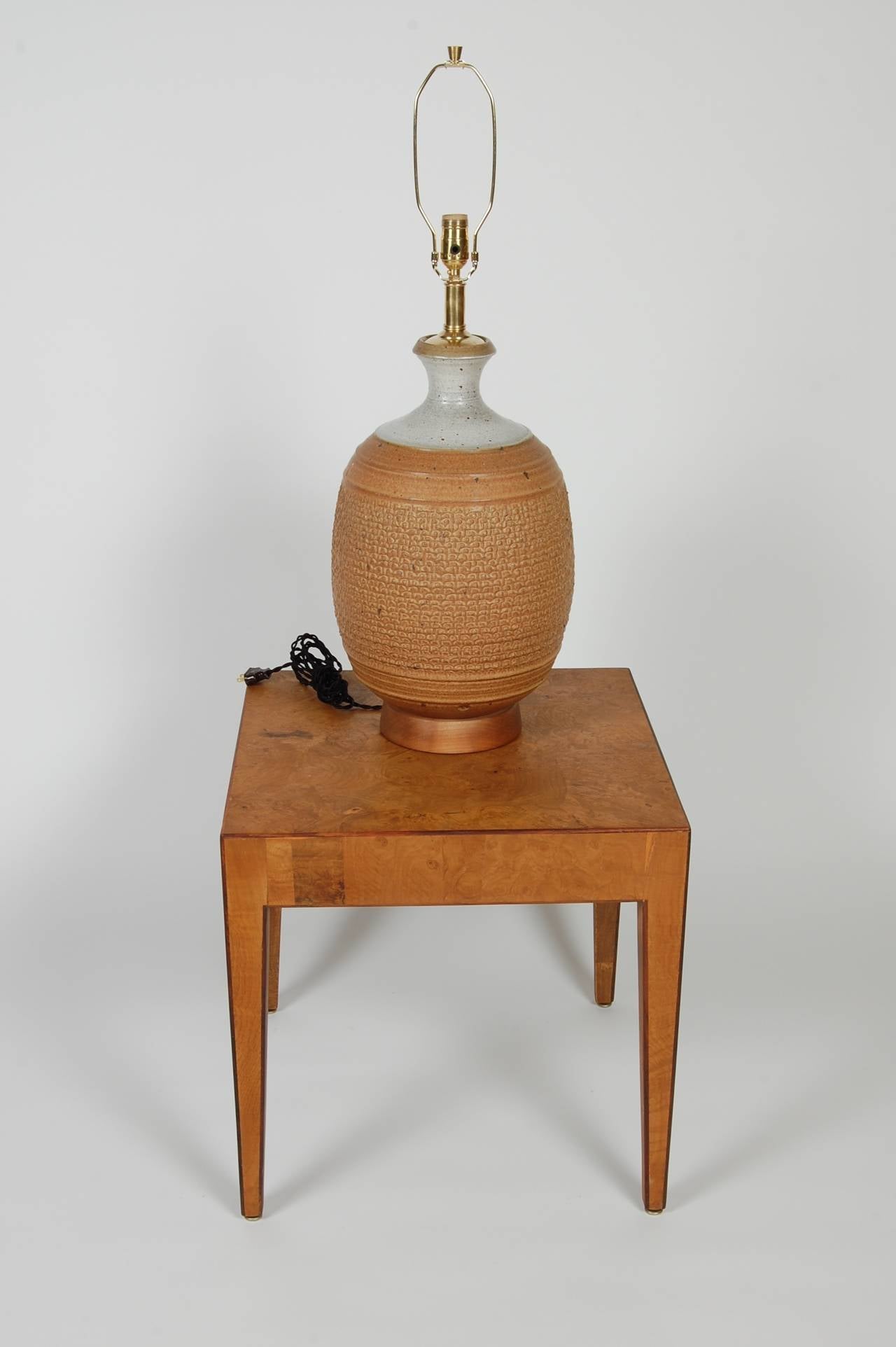 Large studio ceramic lamp by Phil Barkdoll of affiliated craftsman of which Bob Kinzie was a partner. Two-tone body with a textured earthenware bottom and a lighter glazed top. Stamped with the potters mark, new hardware and wiring.