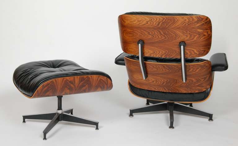Eames lounge and ottoman with all book matched rosewood with a very dramatic grain. Reupholstered in high quality butter soft European leather and rosewood has been reconditioned as per original Herman Miller specifications. A very fine example.