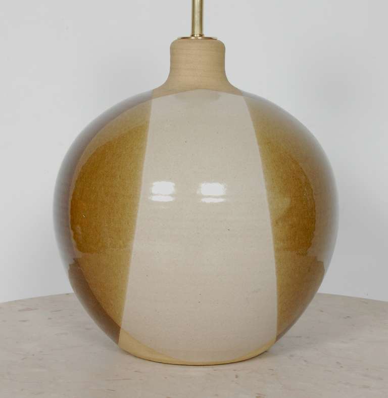 Spheric form ceramic studio table lamp signed Brown with a three color glaze finish. bottom. All new wiring and electrical components which includes a 3 way switch as well as solid brass fittings. The lamp is 17.5 tall at the top of the socket,