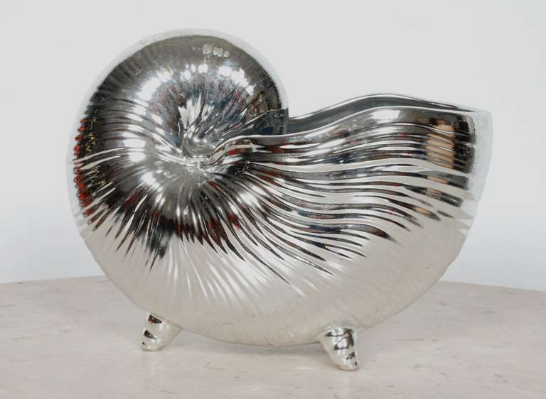 Fritz and Floyd ceramic nautilus shell glazed in a metallic sliver glaze.
