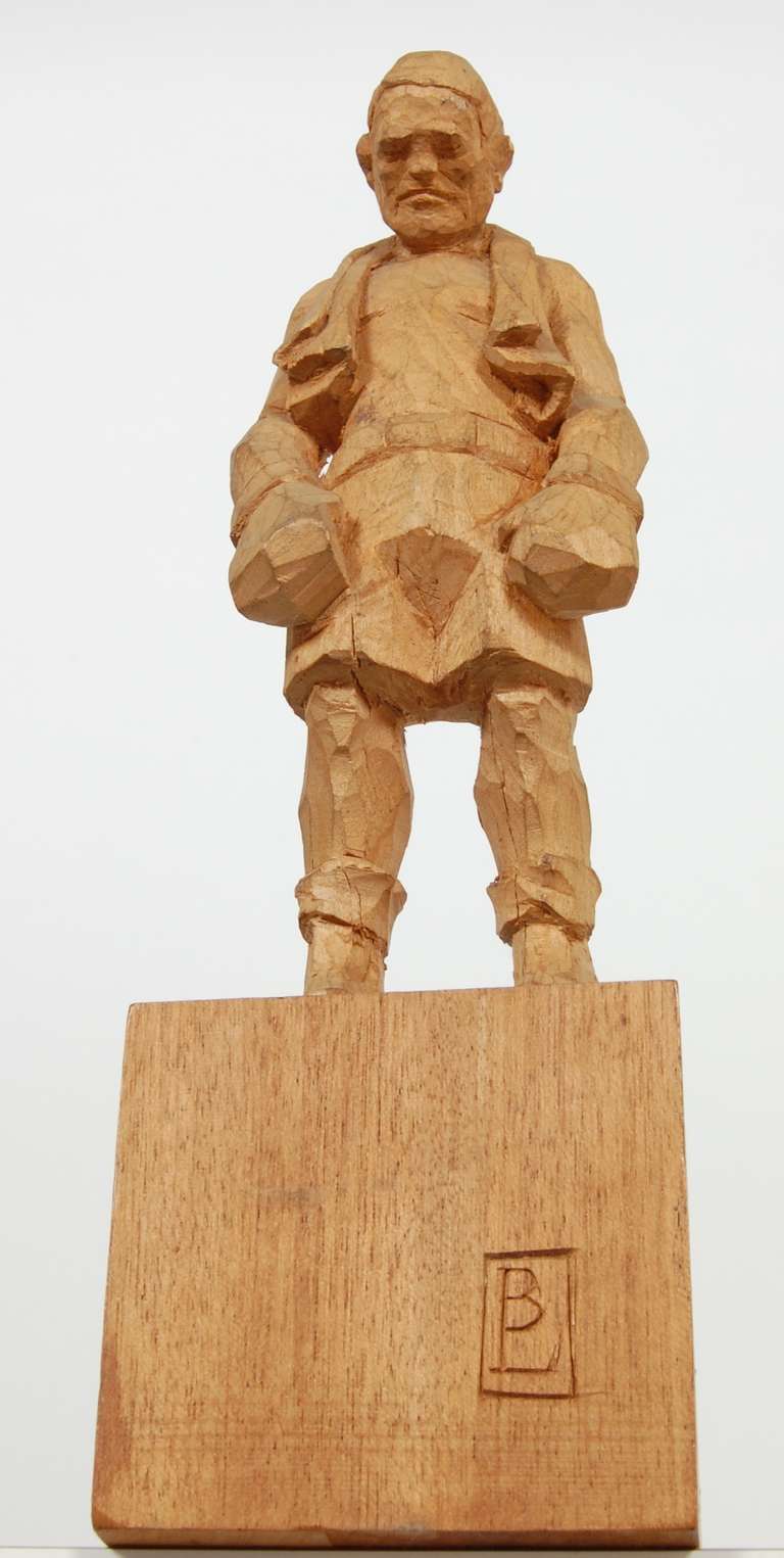 Hand-carved wood boxer figure by American artist Bud Odell (1920-2003). After the bout depiction of an Modern Gladiator of the ring. This piece was created sometime during the 1960s.