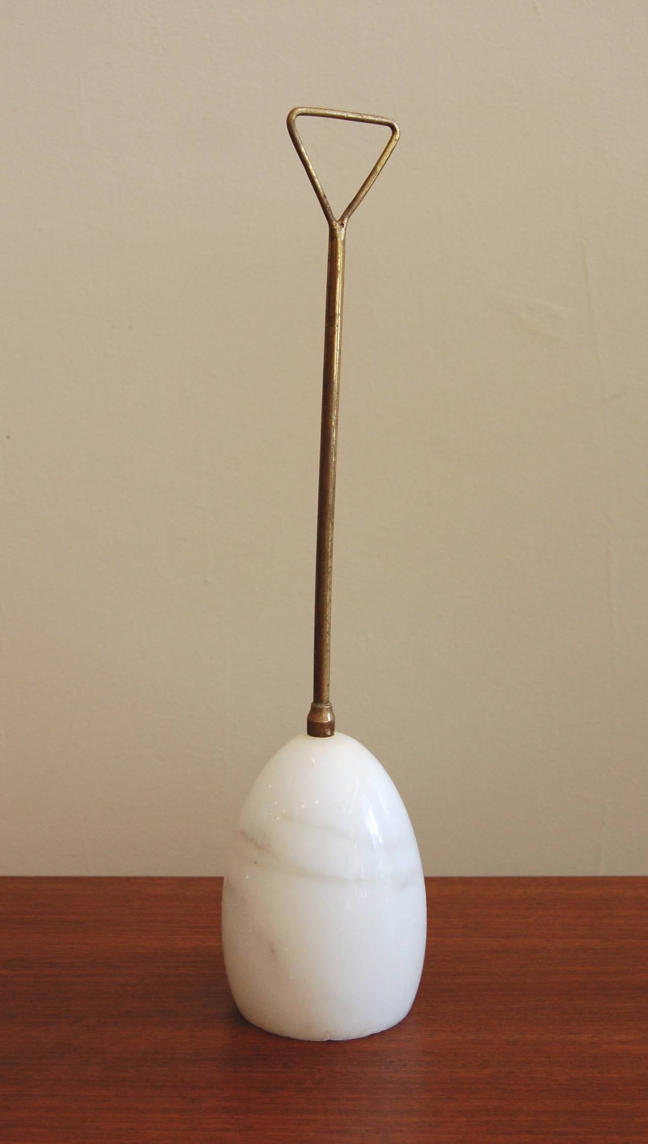 Vintage 1960s marble and brass door stop by Luigi Caccia Dominioni for Azucena of Milan. Brass handle with a nice patina (which can be polished out) attached to the Carrara marble base, in very nice vintage condition.