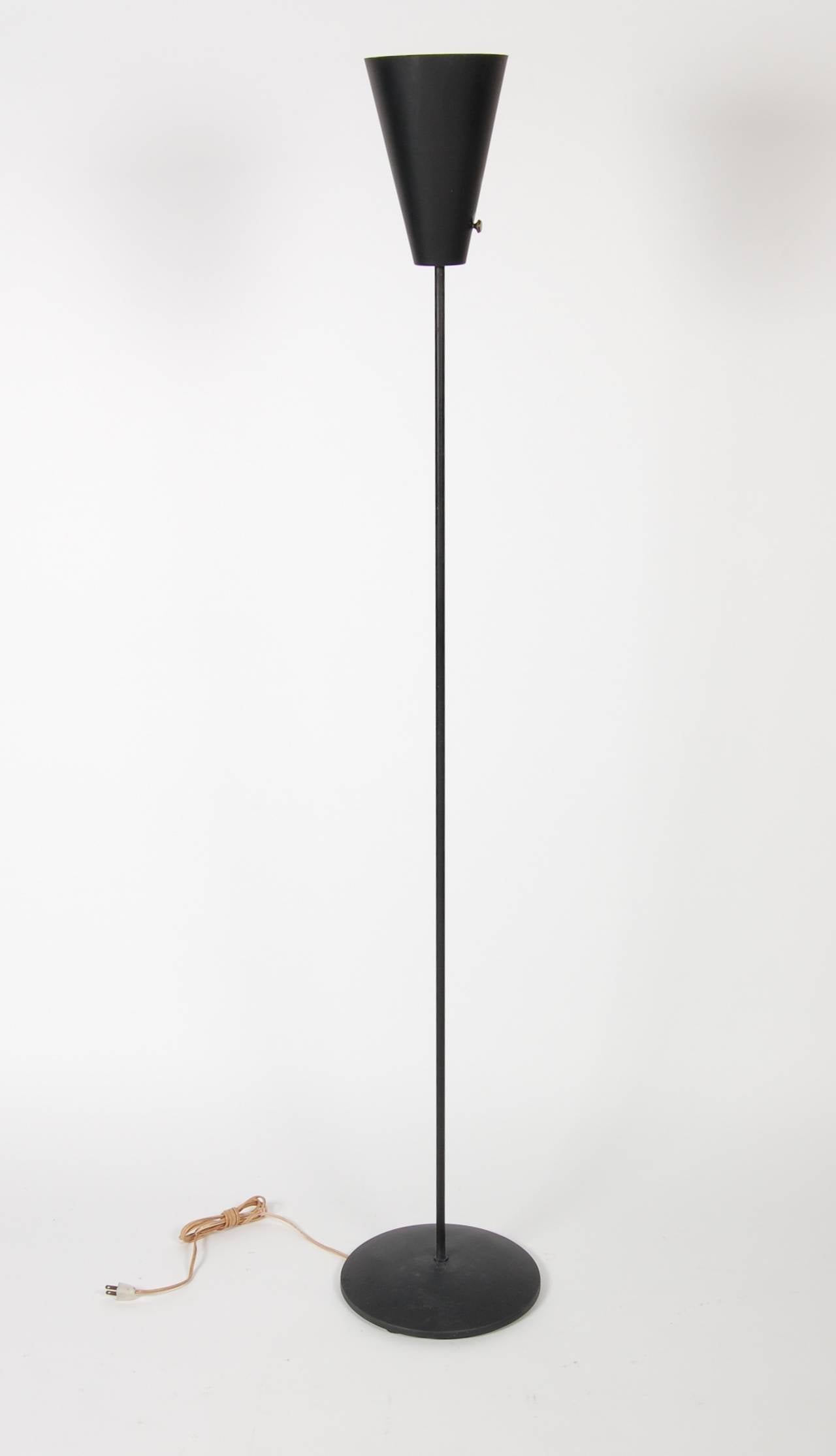 Produced in the early 1950s by the Berkeley company Prescolite, this torchiere floor lamp evokes the design credo of the Case Study House program of the period. Sleek and modern for its day. Original mat black finish, thin stem and the cone with a