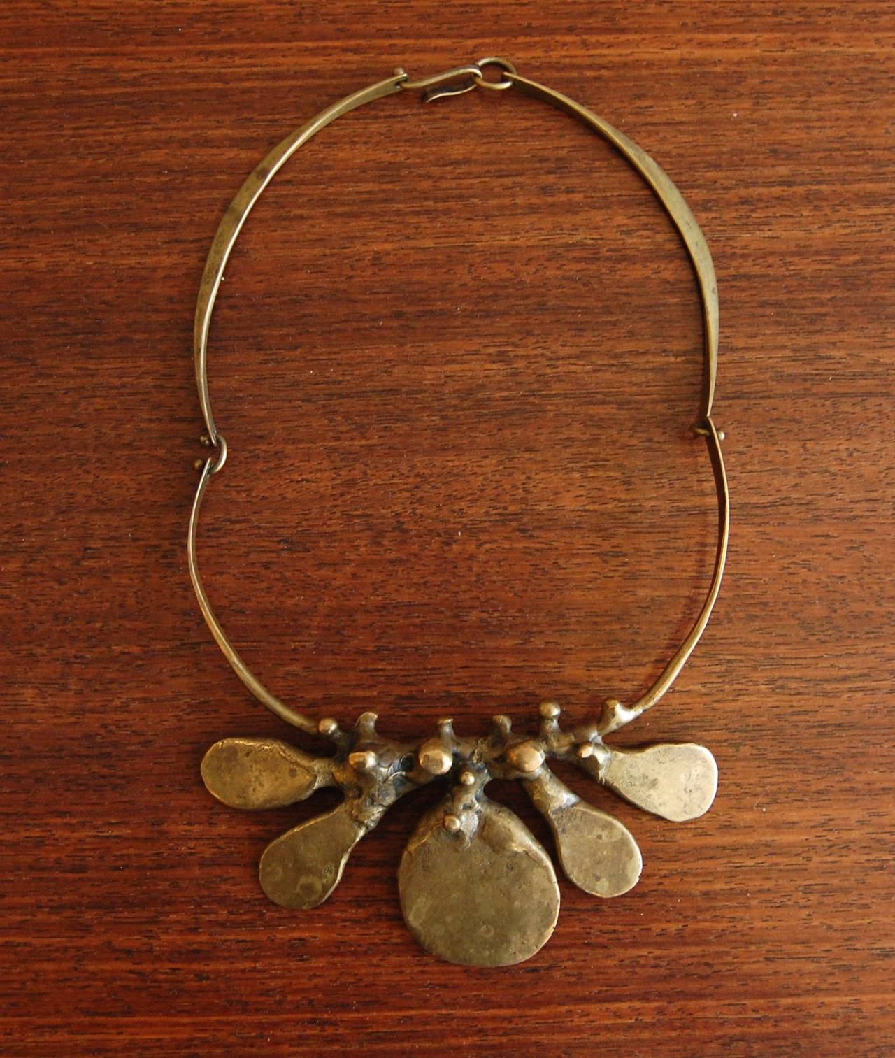 Bronze abstract necklace by San Diego artist / craftsman Jack Boyd. A noted metalsmith in both jewelry and sculpture, Boyd was a member of the Allied Craftsman a collective group of the best artists of San Diego of the 1950s and 60s. The bronze has